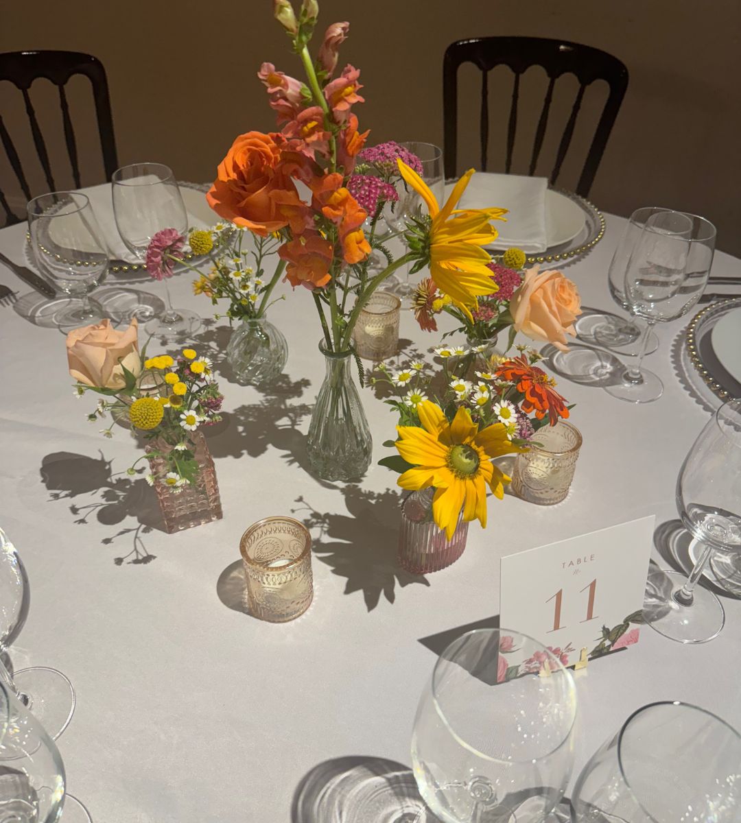 Wedding tablescape with bud vases and flower stems from Winters Farm