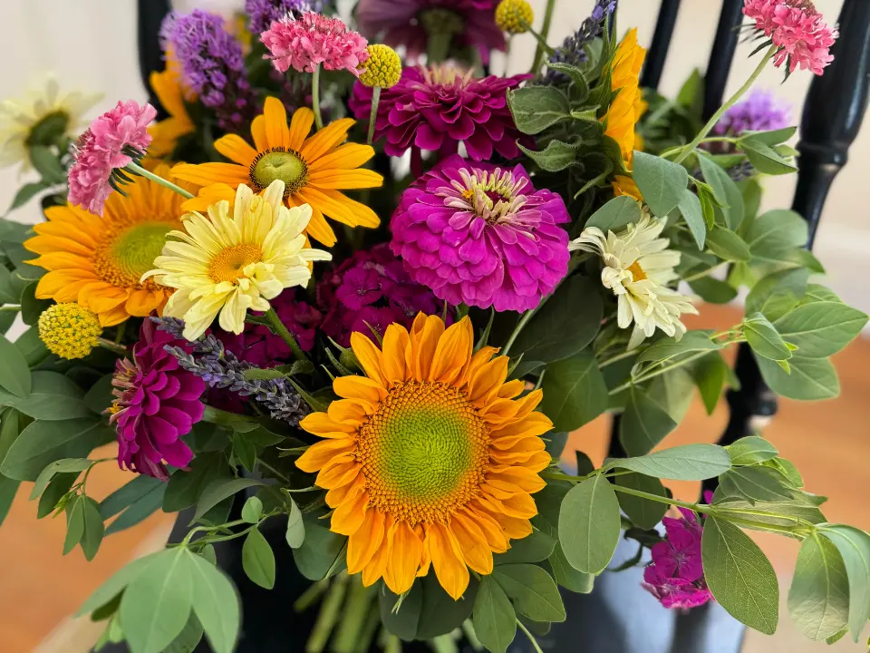 Seasonal arrangement with pink, orange and yellow