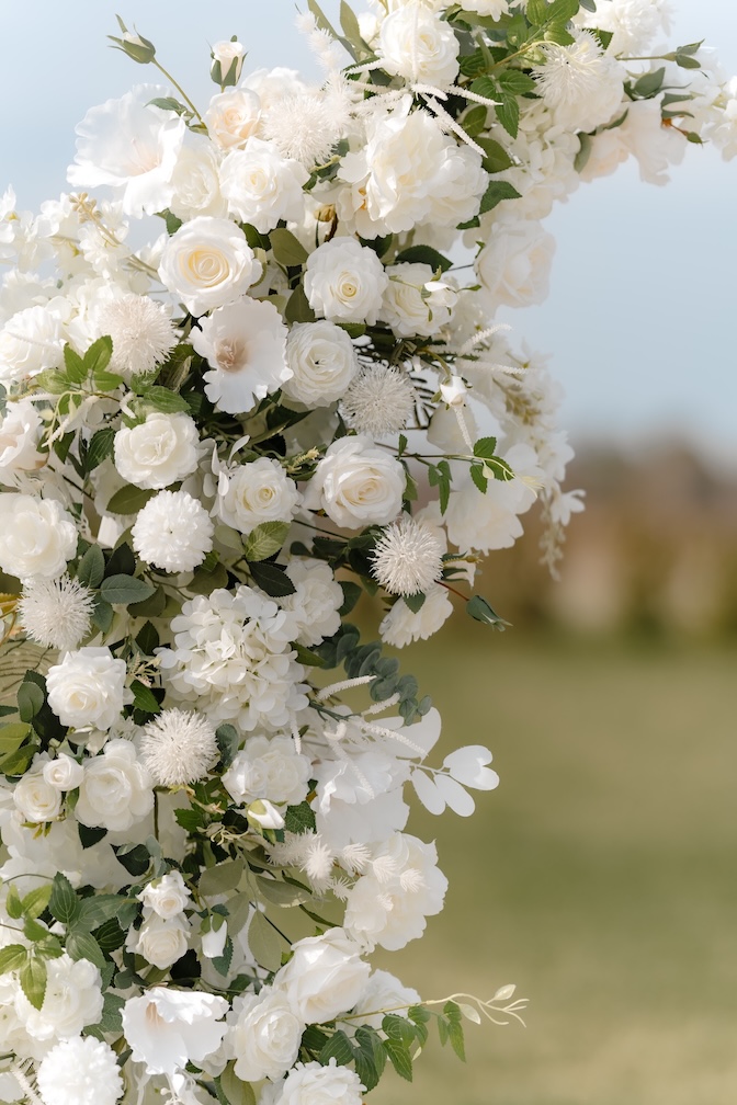 White and green floral pillar up close