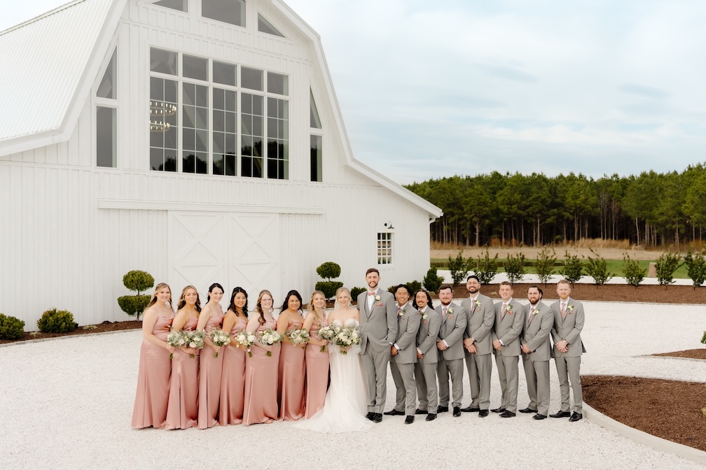 Wedding Party together in front of Breckenridge Barn