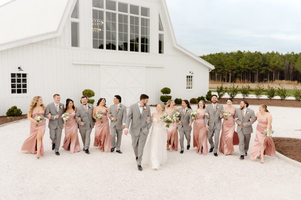 Wedding Party walking towards the camera in front of Breckenridge Barn